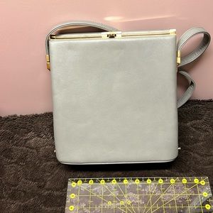 Rigid grey non leather bag. Never used